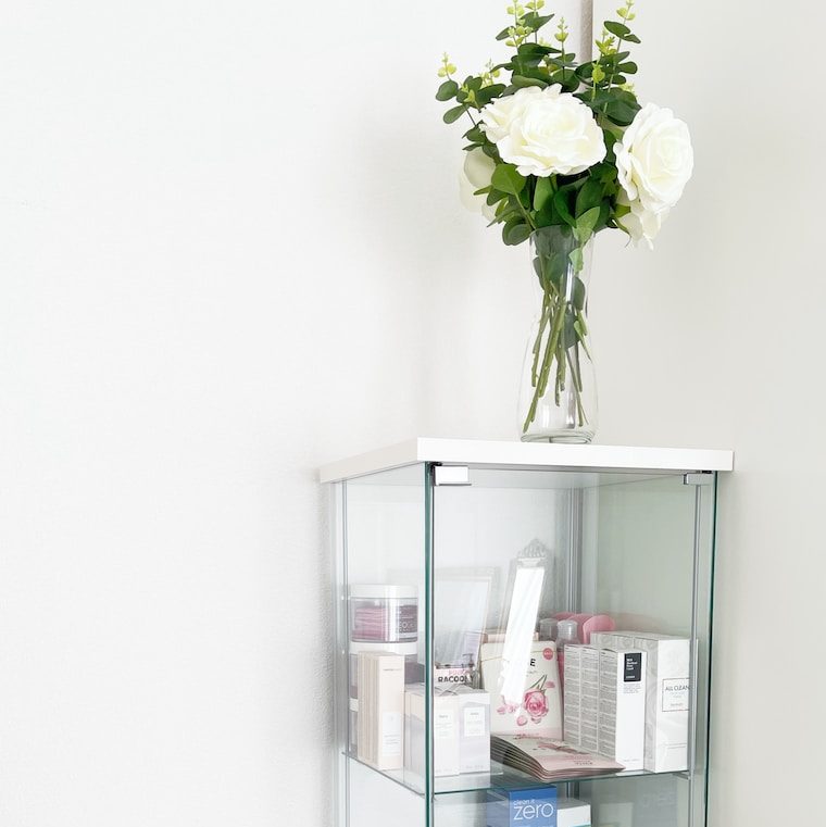 a vase of flowers on a shelf